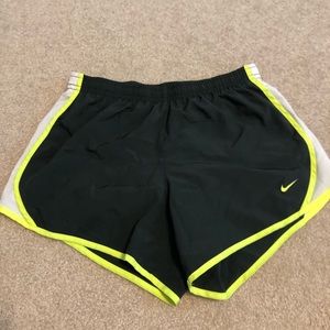 grey and neon green nike shorts